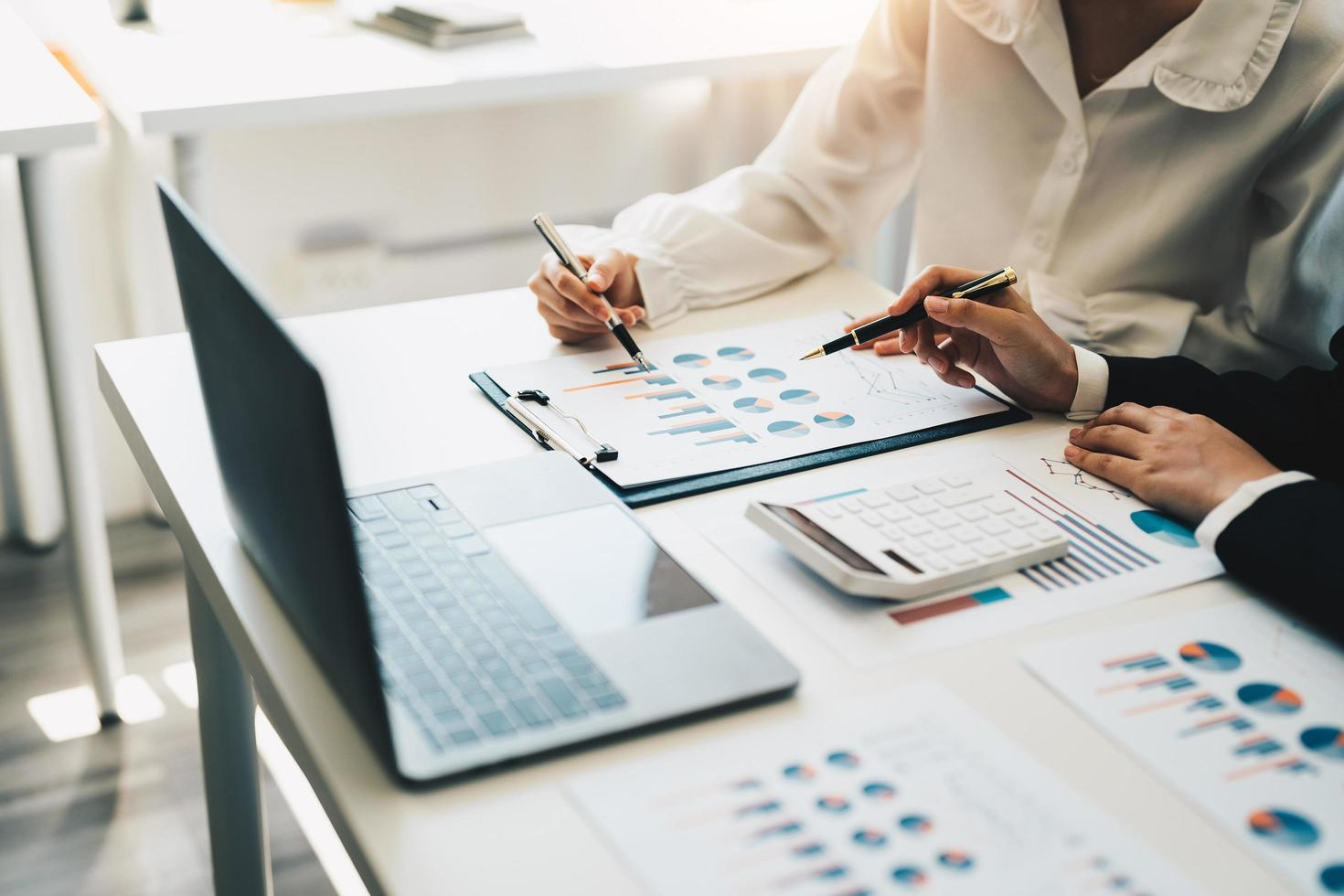 two businessman reviewing portfolio charts