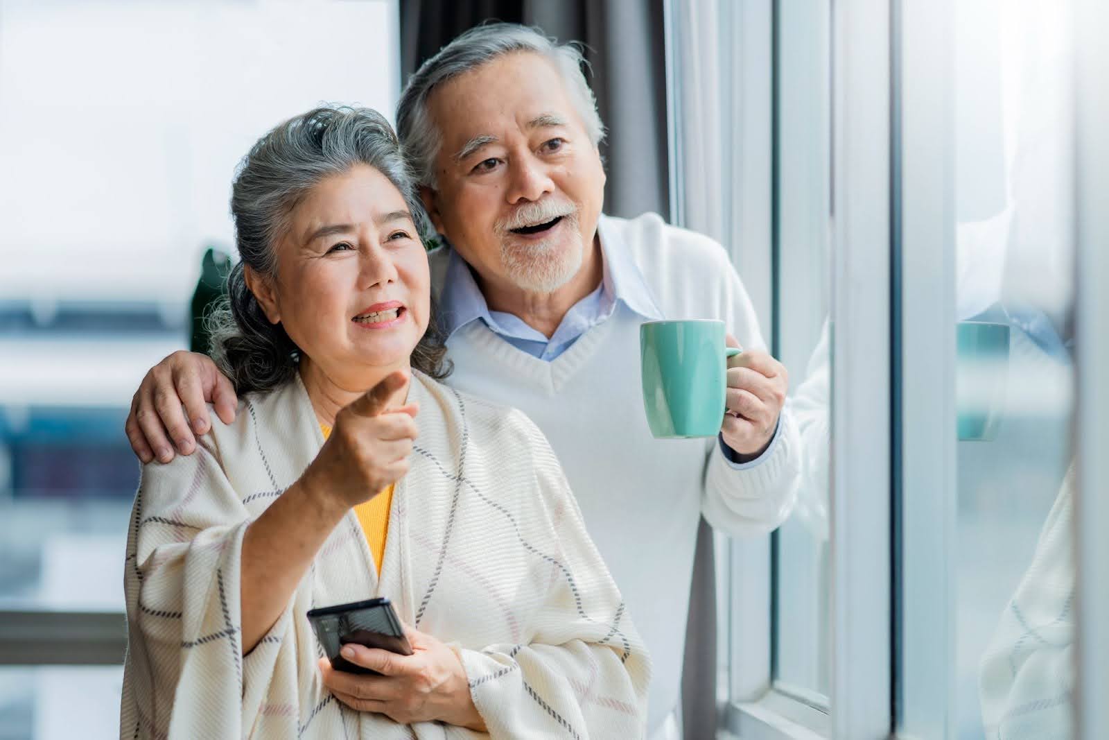 elderly couple positive about annuities for retirement planning